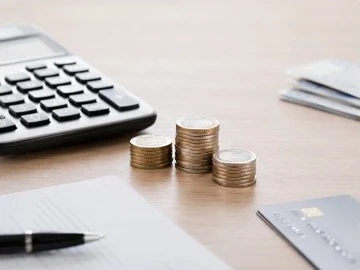 Calculatrice et pièces illustrant un défaut de paiement